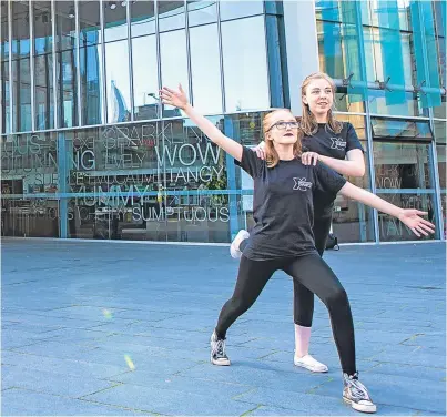  ?? Picture: Steven Brown. ?? Niamh Anderson, 15, left, and Hannah Duguid, 16, practise some of their moves outside Perth Concert Hall.