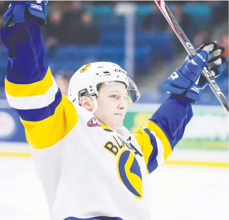  ?? MATT SMITH ?? Saskatoon Blades defenceman Scott Walford celebrates his first-period goal against the Prince Albert Raiders during WHL action at the Sasktel Centre on Saturday.