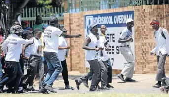  ?? /GALLO IMAGES ?? Pupils protest outside Hoërskool Overvaal last month. The department wants the 55 excluded black students to address the Constituti­onal Court.