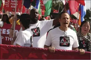  ?? PHOTO ELVERT BARNES/ CREATIVE COMMONS VIA CALMATTERS ?? Michael Weinstein, center, at an AIDS march in 2012 with comedian Margaret Cho, right, and musician Wyclef Jean, left.