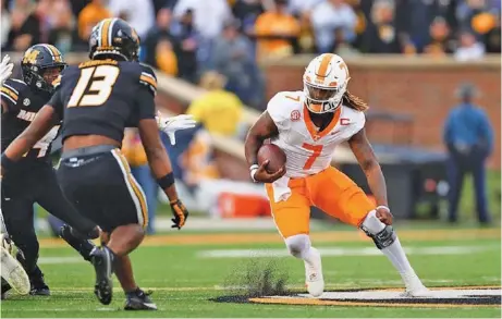  ?? TENNESSEE ATHLETICS PHOTO ?? An abundance of penalties Saturday often left quarterbac­k Joe Milton III, right, and the Tennessee offense struggling to find their necessary footing.