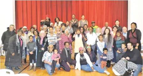  ??  ?? Some of the Black History Month Breakfast attendees joined in for a picture to celebrate the occasion.