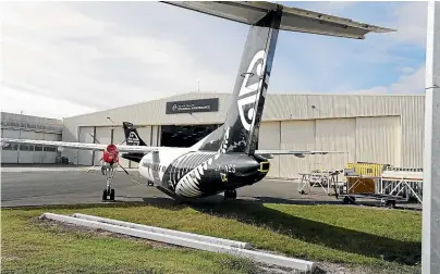  ?? MARTIN DE RUYTER/STUFF ?? An Air New Zealand Q300 aircraft outside the Air New Zealand Regional Maintenanc­e hangar at Nelson Airport.