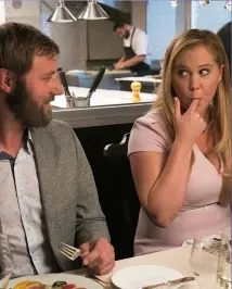  ??  ?? date nIGht Renee with her sensitive love interest Ethan (Rory Scovel).