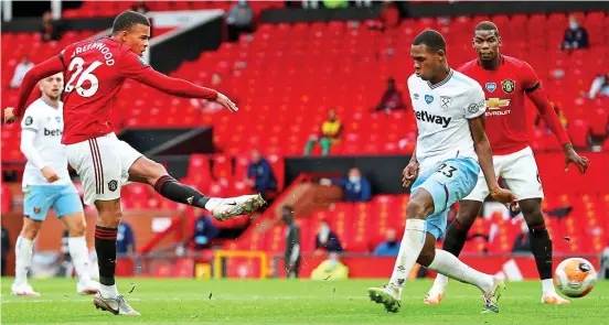  ??  ?? Level pegging: Greenwood fires homes Manchester United’s second-half equaliser against West Ham at Old Trafford