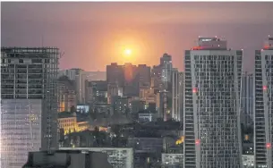  ?? REUTERS ?? An explosion is seen in the sky over the city during a Russian drone and missile strike in Kyiv yesterday.