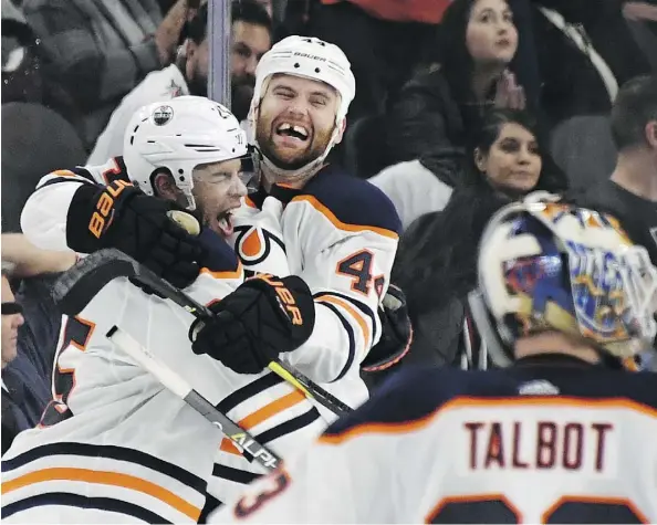  ?? ETHAN MILLER/GETTY IMAGES ?? Darnell Nurse and Zack Kassian, right, of the Edmonton Oilers celebrate after Nurse scored an overtime goal against the Vegas Golden Knights to win their game 3-2 at T-Mobile Arena on Saturday in Las Vegas. The loss ended the Knights’ seven-game home...