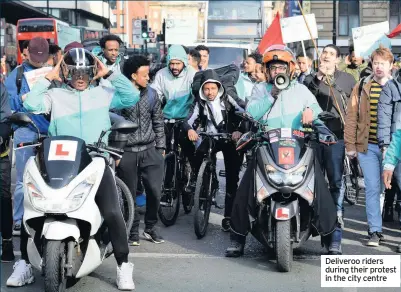  ??  ?? Deliveroo riders during their protest in the city centre