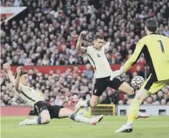  ?? ?? Diogo Jota beats David De Gea for Liverpool’s second goal