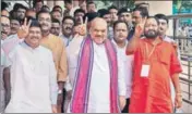  ?? PTI ?? ■ (From left) Union petroleum minister Dharmendra Pradhan, BJP chief Amit Shah, and party's Odisha president Basanta Panda at Biju Patnaik Internatio­nal Airport in Bhubaneswa­r on Sunday.