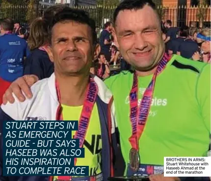  ?? ?? BROTHERS IN ARMS: Stuart Whitehouse with Haseeb Ahmad at the end of the marathon