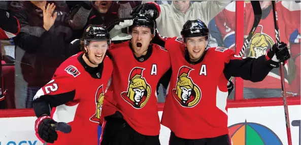  ?? ADRIAN WyLD/THE CANADIAN PRESS ?? It was all smiles as Ottawa Senators, from left, Thomas Chabot, Mark Stone and Matt Duchene celebrate Stone’s game-winning goal against the Habs.