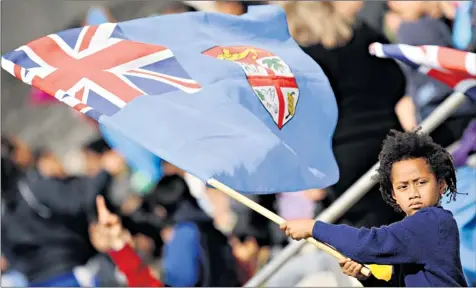  ??  ?? The Fijian flag, which features the Union flag and a coat of arms depicting a British lion holding a cocoa pod, is to be ‘revamped’, say the country’s military rulers