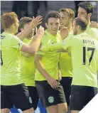  ??  ?? ■
John McGinn celebrates his goal with his team-mates.