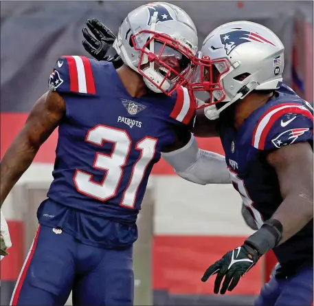  ?? MATT STONE — BOSTON HERALD ?? Patriots defensive back Jonathan Jones, left, celebrates his touchdown with Ja’Whaun Bentley during a Nov. 6, 2022 game in Foxboro against the Indianapol­is Colts. He said he would like to remain with the franchise.