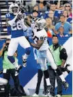  ?? Michael Hickey / Getty Images ?? The Colts’ Greg Toler picks off a pass intended for the Raiders’ Rod Streater.