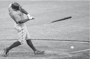  ?? Nick Wass / Associated Press ?? The Astros’ George Springer is left holding the short end of the stick, but his infield single started a three-run rally in the seventh inning to briefly tie the game Wednesday.