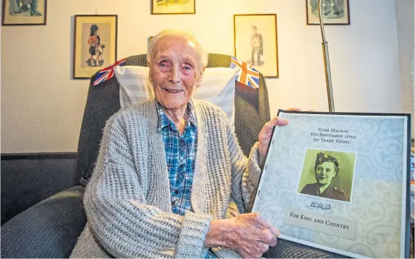  ?? ?? LOOKING BACK: Elsie Mackay, aged 102, looks at memories of her time serving her country. Picture by Steve Macdougall.