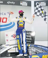  ?? NELL REDMOND — THE ASSOCIATED PRESS ?? Chase Elliott celebrates after winning Sunday’s NASCAR Cup Series race at Charlotte Motor Speedway. Kyle Busch, 2019 season champion, was eliminated from the playoff in the race.