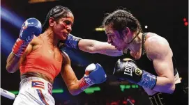  ?? AP ?? Katie Taylor (right) punches Amanda Serrano during the 10th round of their lightweigh­t championsh­ip boxing bout Saturday in New York. Taylor won the bout.