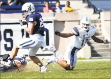  ?? Peter Hvizdak / Hearst Connecticu­t Media ?? Yale safety Hayden Carlson intercepts a pass against Columbia on Saturday at Yale Bowl.