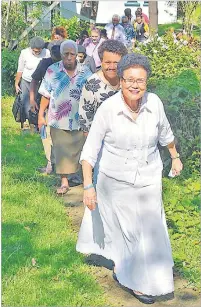  ??  ?? Businesswo­man Mere Samisoni (front) during the opening of the new teachers quarters at Ballantine Memorial School in Delainaves­i, Lami.