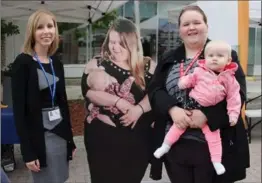  ?? PORCUPINE HEALTH UNIT, THE CANADIAN PRESS ?? Porcupine Health Unit public health nurse Meagan Potvin, left, and models Laurissa and Winter Crocetti beside one of the Breastfeed­ing in Public cut-outs at Urban Park in Timmins.