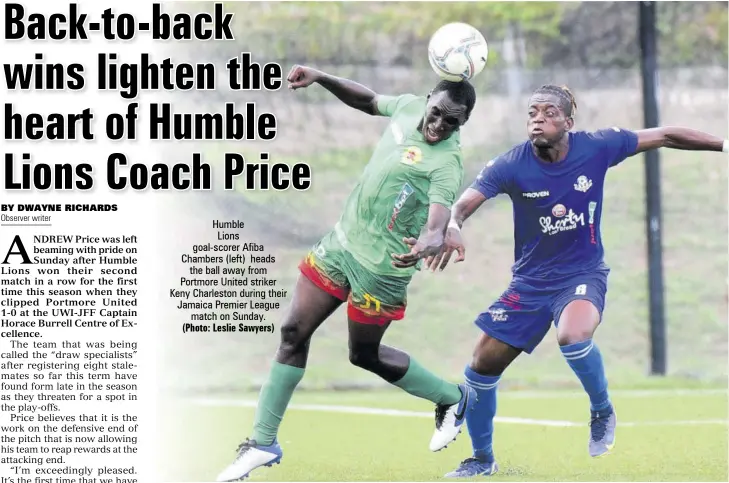  ?? (Photo: Leslie Sawyers) ?? Humble
Lions goal-scorer Afiba Chambers (left) heads the ball away from Portmore United striker Keny Charleston during their Jamaica Premier League match on Sunday.