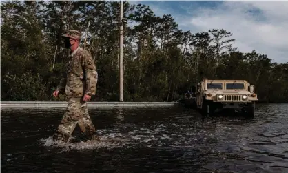  ?? Dan Anderson/EPA ?? Louisiana National Guard assist in search and rescue missions during flooding from Hurricane Ida in Louisiana in August. Photograph: