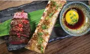  ?? Baku Waikiki ?? Baku Waikiki serves Spicy Filet of Beef with bone marrow, sukiyaki sauce and raw egg yolk.