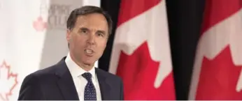  ?? FRANK GUNN/THE CANADIAN PRESS ?? Finance Minister Bill Morneau’s latest budget aims to boost exports of goods and services 30 per cent by 2025.