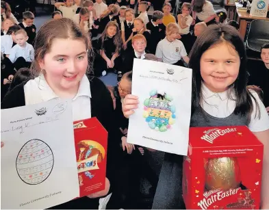  ??  ?? Egg-cellent work Winner Lauren Muirzynske, right, with fellow Plains Primary pupil Lucy Kearney