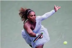  ?? — AFP ?? Serena Williams of the US returns a shot during her match against Kaia Kanepi of Estonia at the USTA Billie Jean King National Tennis Center in New York City.