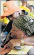  ?? Picture: FREDLIN ADRIAAN ?? HELPING HAND: ANC task team member Dipuo Kondile comforts Mathabo Bookholane at the Port Elizabeth airport yesterday