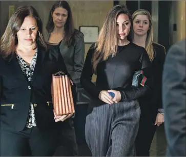  ?? David Dee Delgado Getty Images ?? PROSECUTOR Joan Illuzzi-Orbon, left, arrives at court in New York with Jessica Mann. Illuzzi-Orbon told the jury that Harvey Weinstein kept in contact with his victims to control and isolate them.