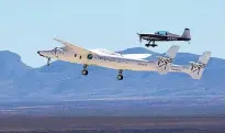  ?? GREG SORBER/JOURNAL ?? Virgin Galactic’s WhiteKnigh­tTwo and a chase plane fly operationa­l tests at Spaceport America in southern New Mexico.