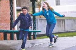  ?? RICK BOWMER THE ASSOCIATED PRESS ?? Caleb Coulter, 10, and his sister Kendra, 12, play tag during a visit to the Place Heritage Park in Salt Lake City Sunday. Critics say letting children strike out on their own can expose them to dangers. But lawmakers and advocates in several states...