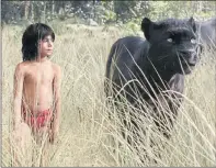  ??  ?? TOGETHER: Mowgli and Bagheera (voiced by Ben Kingsley).