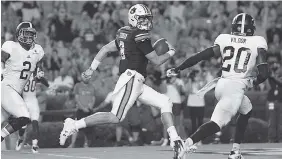  ?? DAKOTA SUMPTER/AUBURN PHOTO ?? Jarrett Stidham threw for two touchdowns during his debut last week as Auburn’s starting quarterbac­k, and he also had this 14-yard touchdown run as the Tigers thumped Georgia Southern 41-7.