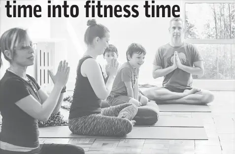  ??  ?? Linda Feldman, left, leads a family class at Circle Yoga in Washington. Elias O’Keefe and mom Deanna Ortiz, centre, and Tristan Eckert and dad Christophe­r Sperl participat­e. — WPBloomber­g photos