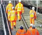  ??  ?? Engineers: Staff on the tracks