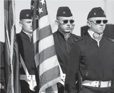  ?? Dana Jensen, The Day ?? The Navy JROTC color guard from Widefield High School near Colorado Springs parades the colors Saturday at the start of the commission­ing ceremony for the Virginia-class fast attack submarine USS Colorado (SSN 788) at Naval Submarine Base New London in...