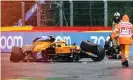  ??  ?? Race marshalls and technician­s clear Lando Norris’s McLaren after he crashed in qualifying. Photograph: Kenzo Tribouilla­rd/ AFP/Getty Images