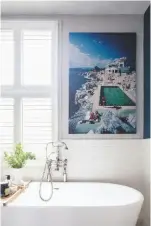  ??  ?? BATHROOM ‘Matt-finish walls have a softer look than gloss,’ says Nicola.
Verona large freestandi­ng bath, £599.95; Crosswater Belgravia crosshead bath shower mixer in nickel, £443, both Victorian Plumbing.
Eden Roc Pool print by Slim Aarons, £195 unframed, Artrepubli­c