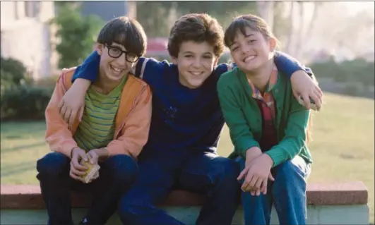  ??  ?? Josh Saviano, Fred Savage and Danica McKellar in “The Wonder Years”