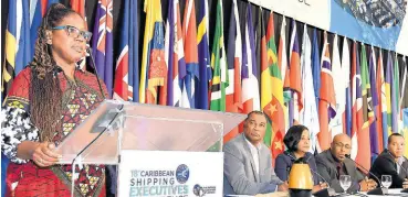  ?? CONTRIBUTE­D PHOTOS ?? IT for the ‘New Normal’: Kay Wilson Kelly (at microphone), operations manager of ADVANTUM Limited, delivers a presentati­on on her company’s informatio­n technology (IT) solutions for the shipping industry at the 18th Caribbean Shipping Executives Conference (CSEC) held in Kingston, Jamaica in 2019. Pictured at the head table are (from right): Dwain Powell, CEO, Port Community System; André Williams, CIO Customs – ASYCUDA; Anna Hamilton, manager, Marketing Department, Jamaica Freight & Shipping Limited; and William Brown, MD, Lannaman & Morris Shipping.