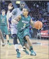  ?? JAY MORRISON / STAFF ?? Wright State’s Reggie Arceneaux looks for an opening as he maneuvers around Cleveland State defenders during the Horizon League tournament semifinal. Arceneaux finished with eight points on 3-for-3 shooting.