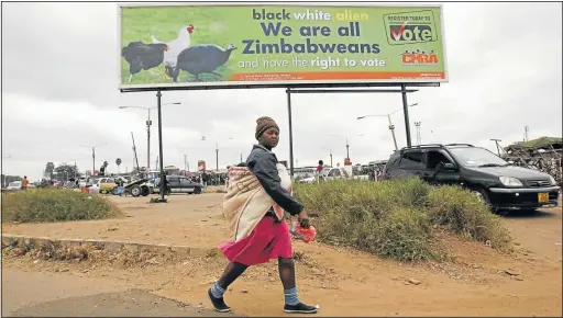  ??  ?? TELLTALE SIGNS: The billboard in Harare's Mbare township urges people to register to vote in the presidenti­al and parliament­ary elections scheduled for July 31, but Southern Africa leaders believe that there should be a delay to give all voters the...