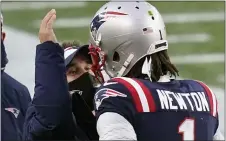  ?? ELISE AMENDOLA – THE ASSOCIATED PRESS ?? Patriots offensive coordinato­r Josh McDaniels, left, celebrates a touchdown catch by quarterbac­k Cam Newton, right, in the second half of a game against the New York Jets on Jan. 3in Foxborough, Mass.