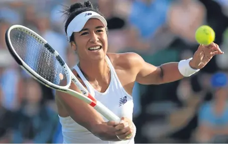  ?? Picture: PA. ?? Heather Watson concentrat­es on a volley during her 6-1 7-6 win over Maryna Zanevska.